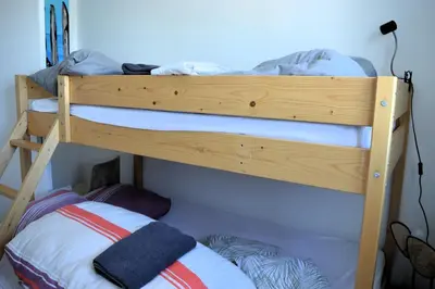 Un ou plusieurs lits dans un hébergement de l'établissement Le Caprice de la mer - maison avec véranda, jardin
