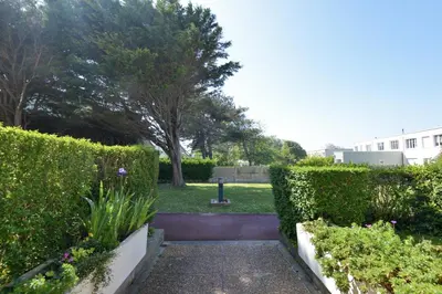 Jardin de l'établissement Chez Flora - Appt pour 4 proche de la plage