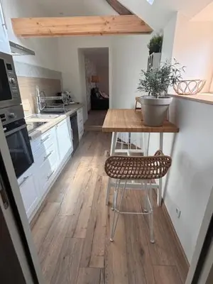 Cuisine ou kitchenette dans l'établissement Le Cottage d'Emmy - Rose