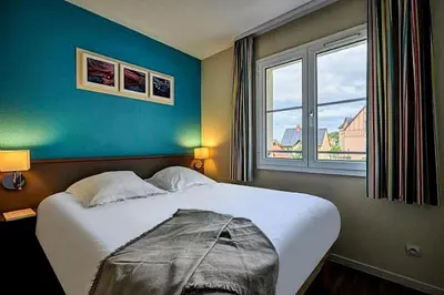 Un ou plusieurs lits dans un hébergement de l'établissement Résidence Port Guillaume - maeva Home - Appartement 3 pièces 6 personnes - Budget MAE-9231