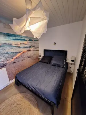 Un ou plusieurs lits dans un hébergement de l'établissement Maisonnette îlot vacances
