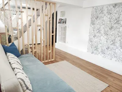 Coin salon dans l'établissement Suite parentale indépendante en ville - chez l'habitant