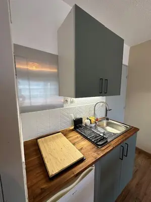 Cuisine ou kitchenette dans l'établissement Appart cosy, balcon, parking