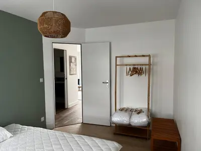 Un ou plusieurs lits dans un hébergement de l'établissement Appartement Granville
