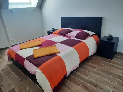 Un ou plusieurs lits dans un hébergement de l'établissement Duplex avec vue sur mer-La Rose des Vents
