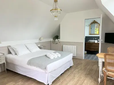 Un ou plusieurs lits dans un hébergement de l'établissement La Chambre du Cottage B&B