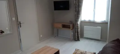 Télévision ou salle de divertissement dans l'établissement Le beau séjour