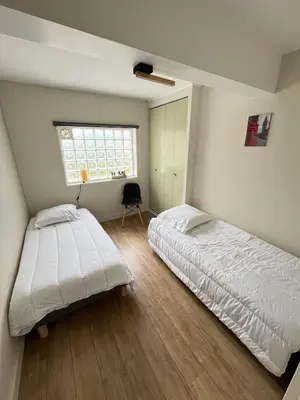 Un ou plusieurs lits dans un hébergement de l'établissement Appartement à 100m de la plage