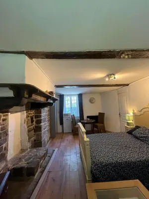 Un ou plusieurs lits dans un hébergement de l'établissement chambre d'hote a la ferme
