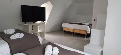 Télévision ou salle de divertissement dans l'établissement Gite isigny omaha