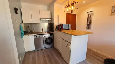 Cuisine ou kitchenette dans l'établissement Appartement lumineux dans résidence calme et arborée