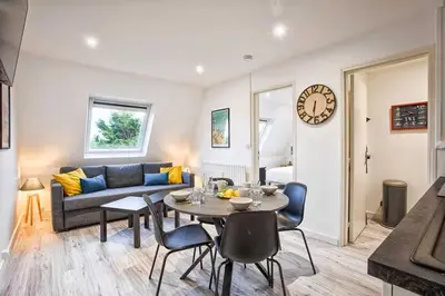 Coin salon dans l'établissement Bel Appartement Cabourg