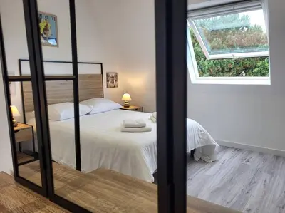 Un ou plusieurs lits dans un hébergement de l'établissement Bel Appartement Cabourg