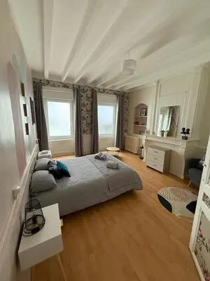 Un ou plusieurs lits dans un hébergement de l'établissement Charmante Maison