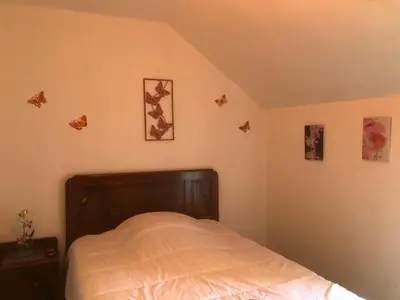 Un ou plusieurs lits dans un hébergement de l'établissement Maison à la campagne