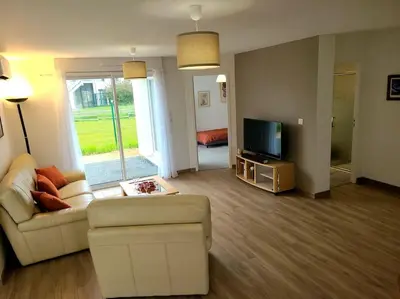 Télévision ou salle de divertissement dans l'établissement Le Littoral