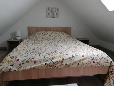 Un ou plusieurs lits dans un hébergement de l'établissement Gîtes Ferme de la Courbée