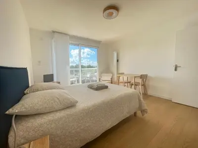 Un ou plusieurs lits dans un hébergement de l'établissement Studio - balcon - bord de mer