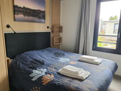 Un ou plusieurs lits dans un hébergement de l'établissement Cottage 4-6 pers-piscine chauffée-150m plage