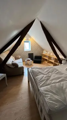 Un ou plusieurs lits dans un hébergement de l'établissement Maisonnette calme