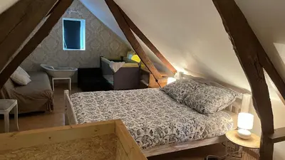 Un ou plusieurs lits dans un hébergement de l'établissement Maisonnette calme