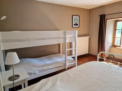 Un ou plusieurs lits dans un hébergement de l'établissement La Maison du Boscq