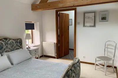 Un ou plusieurs lits dans un hébergement de l'établissement Le Pressoir de la Vieville, Gite Renoir