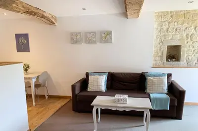 Coin salon dans l'établissement Le Pressoir de la Vieville, Gite St Exupery
