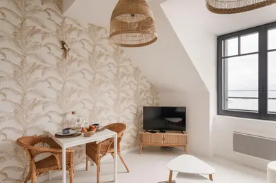 Télévision ou salle de divertissement dans l'établissement Ty Peskaiden 2 - Appt vue mer à Cancale