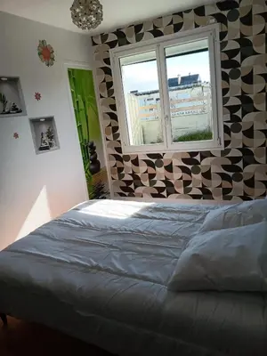 Un ou plusieurs lits dans un hébergement de l'établissement Maison charmante à Port-Bail-sur-Mer, grand jardin clos