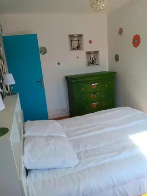 Un ou plusieurs lits dans un hébergement de l'établissement Maison charmante à Port-Bail-sur-Mer, grand jardin clos