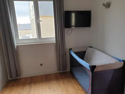 Télévision ou salle de divertissement dans l'établissement La maison de Nadège
