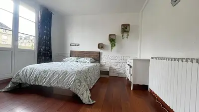 Un ou plusieurs lits dans un hébergement de l'établissement Appartement spacieux à Caen 65 m² avec balcon vue sur la ville