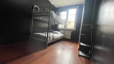 Un ou plusieurs lits dans un hébergement de l'établissement Appartement spacieux à Caen 65 m² avec balcon vue sur la ville