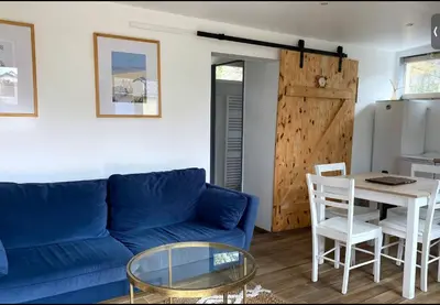 Coin salon dans l'établissement Cottage, L étrille, WIFI gratuit, proche de la mer, jardin, terrasse