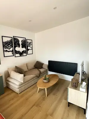 Coin salon dans l'établissement Studio moderne - BELLE AURA