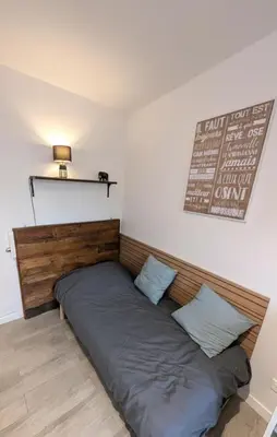 Un ou plusieurs lits dans un hébergement de l'établissement Studio cosy - Proche Zénith