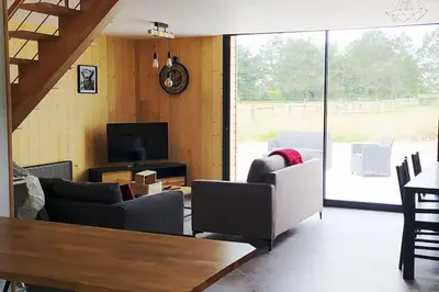 Télévision ou salle de divertissement dans l'établissement Le gîte de la Ferme