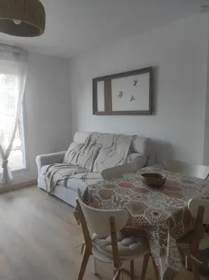 Coin salon dans l'établissement Duplex T3 refait a neuf sur Cabourg 2h30 de paris