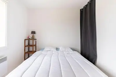 Un ou plusieurs lits dans un hébergement de l'établissement Petite maison chaleureuse avec une vue imprenable