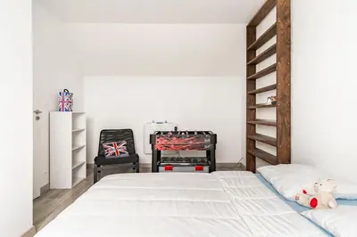 Un ou plusieurs lits dans un hébergement de l'établissement Petite maison chaleureuse avec une vue imprenable