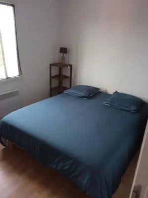 Un ou plusieurs lits dans un hébergement de l'établissement Petite maison chaleureuse avec une vue imprenable