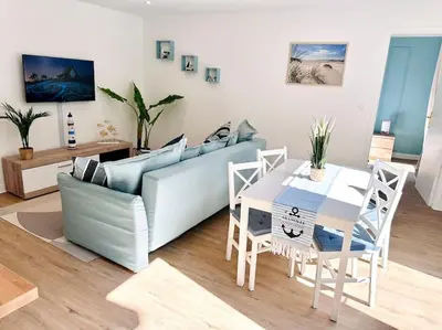 Coin salon dans l'établissement Appartement Au Cœur de Granville