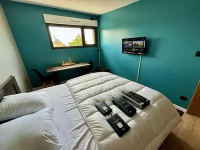 Télévision ou salle de divertissement dans l'établissement Chambre Rozanna
