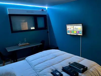 Télévision ou salle de divertissement dans l'établissement Chambre Rozanna