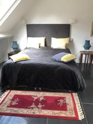 Un ou plusieurs lits dans un hébergement de l'établissement Maison de charme à Coutances