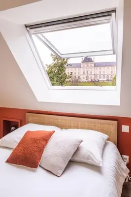Un ou plusieurs lits dans un hébergement de l'établissement Superbe duplex avec vue