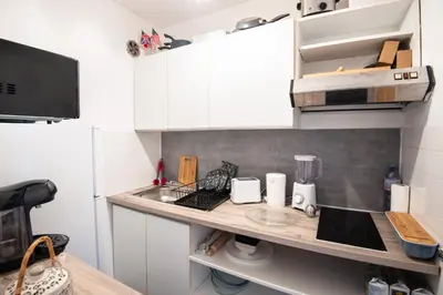 Cuisine ou kitchenette dans l'établissement Titi - À Courseulles-sur-Mer, 7 min de la plage