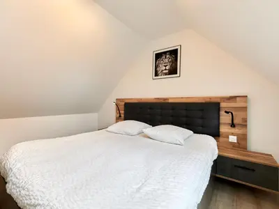 Un ou plusieurs lits dans un hébergement de l'établissement Holiday Home La Bergerie by Interhome