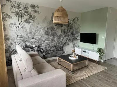 Télévision ou salle de divertissement dans l'établissement Appartement charmant